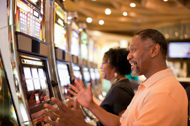 Mobile phone showing beli chip Joker Gaming interface with bet controls and balance display